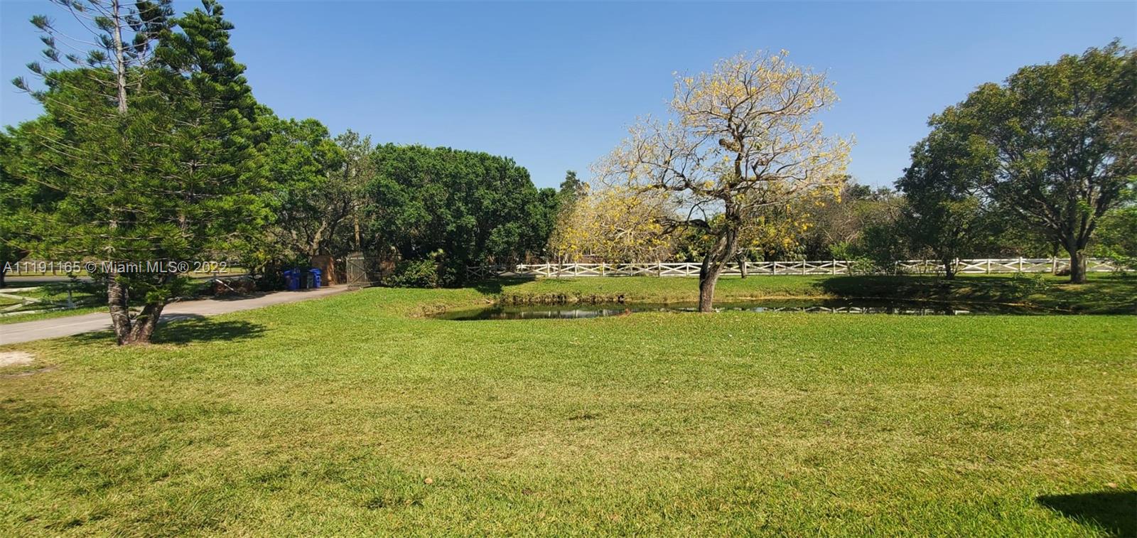 7111 Holatee Trail Southwest Ranches, FL 33330 - Photo 13 of 13 a garden with trees in the background