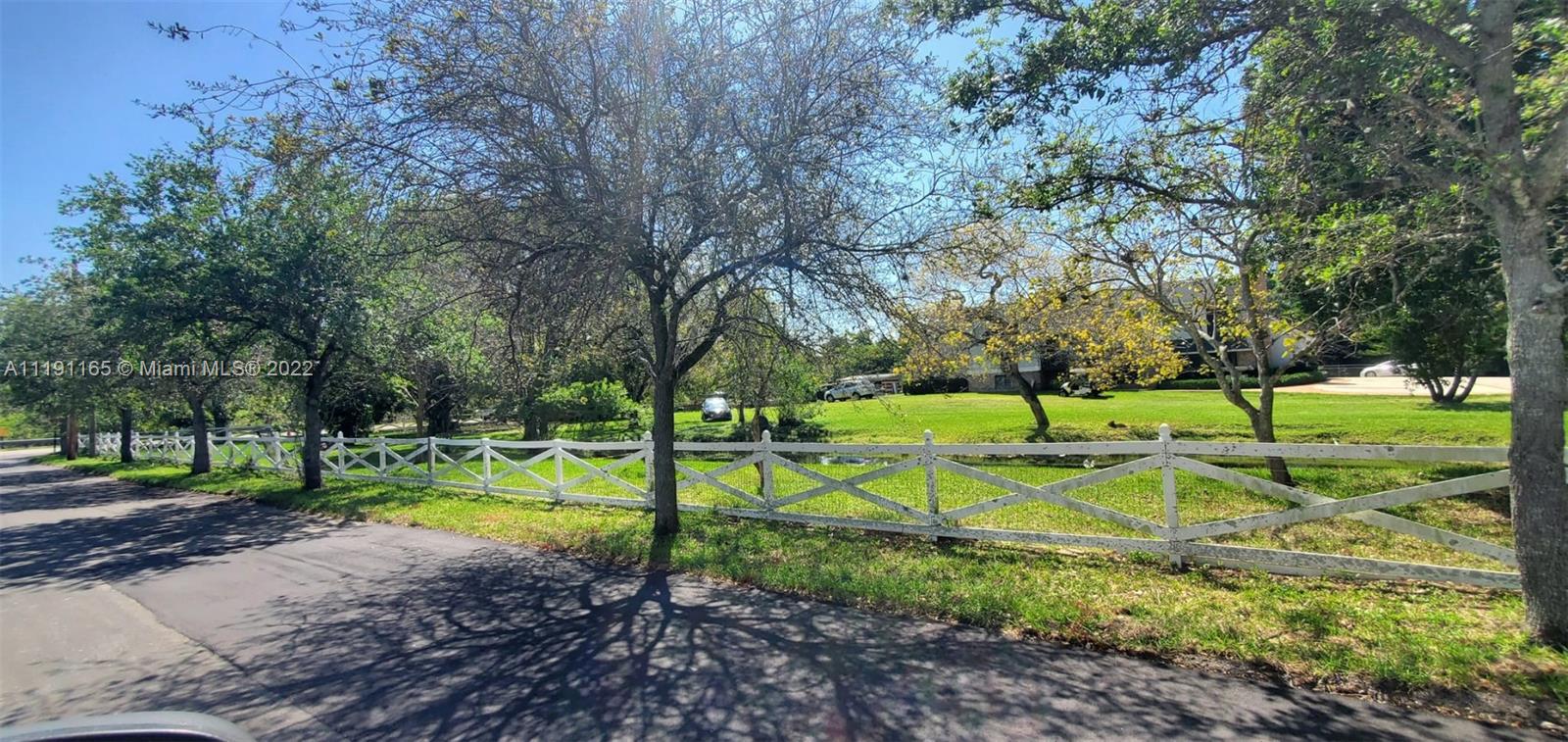 7111 Holatee Trail Southwest Ranches, FL 33330 - Photo 4 of 13 a view of a park with swings and slides