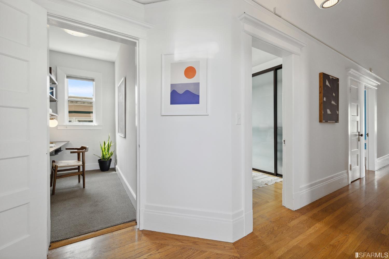 394 Elizabeth Street San Francisco, CA 94114 - Photo 15 of 33 a view of a hallway with wooden floor and a livingroom