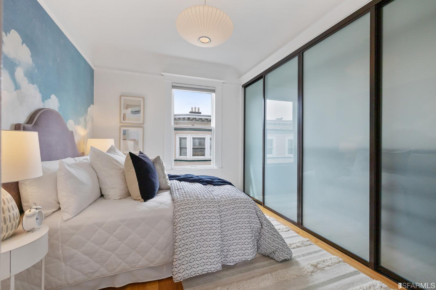 394 Elizabeth Street San Francisco, CA 94114 - Photo 17 of 33 a bedroom with a large bed and a window