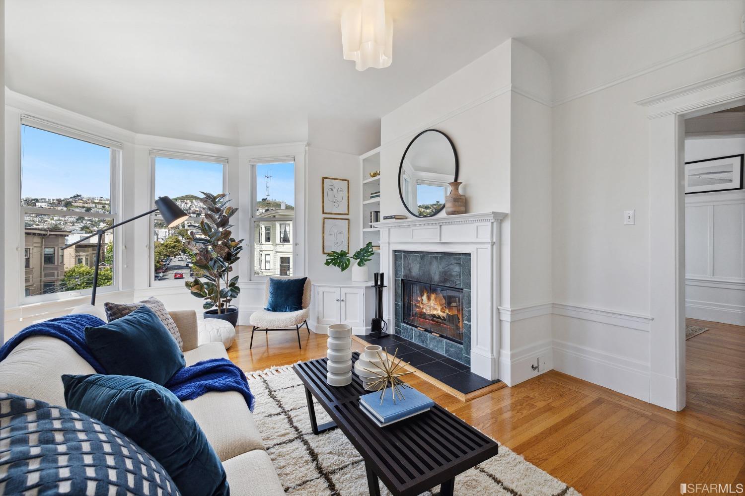 394 Elizabeth Street San Francisco, CA 94114 - Photo 2 of 33 a living room with furniture and a fireplace