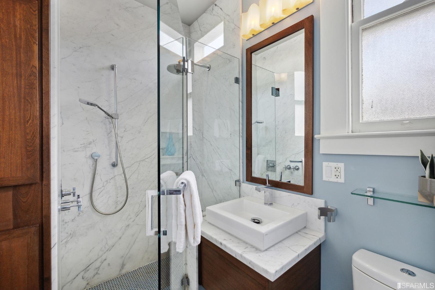 394 Elizabeth Street San Francisco, CA 94114 - Photo 21 of 33 a bathroom with a sink vanity granite and a shower