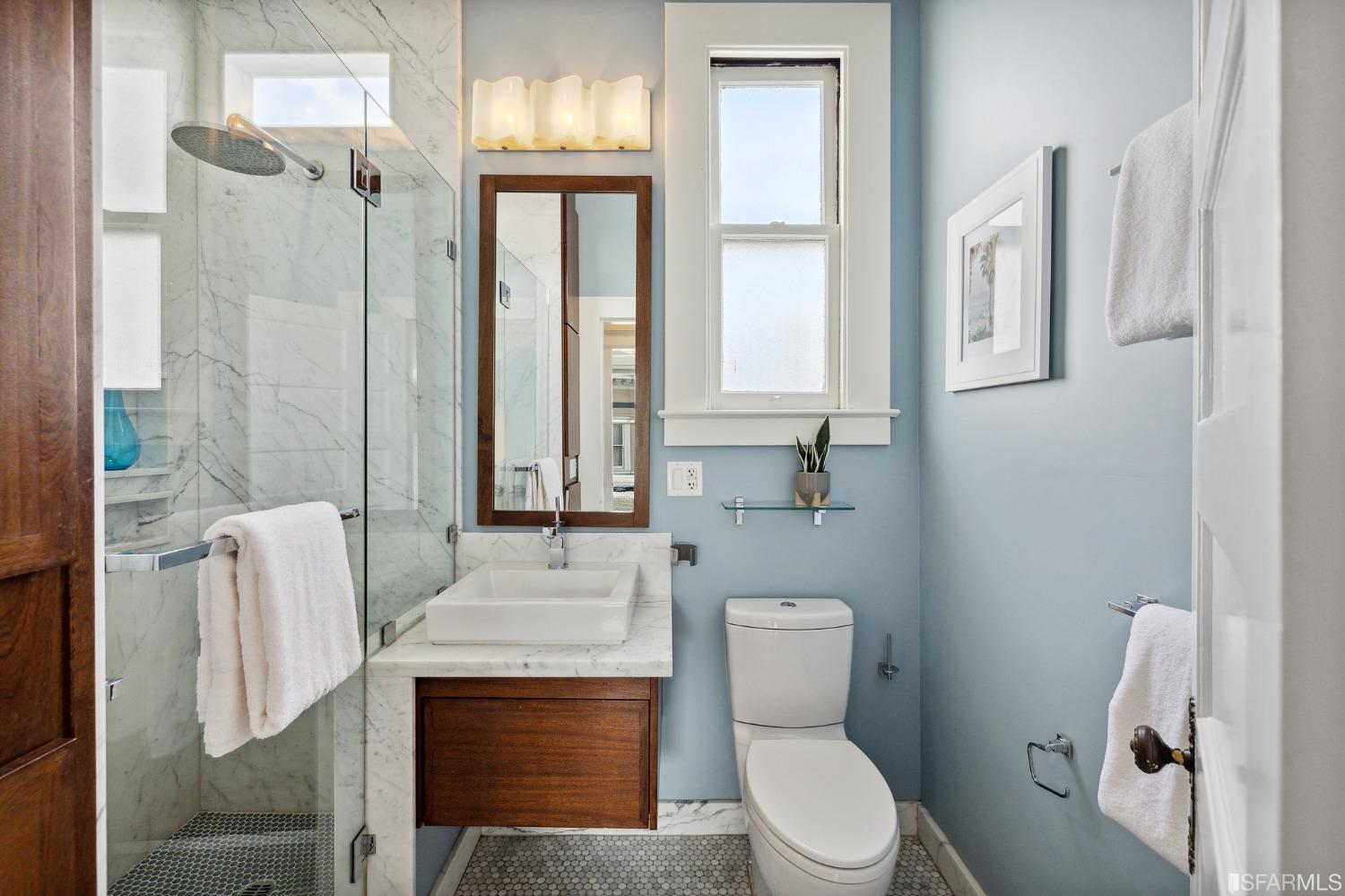 394 Elizabeth Street San Francisco, CA 94114 - Photo 22 of 33 a bathroom with a sink a toilet and shower