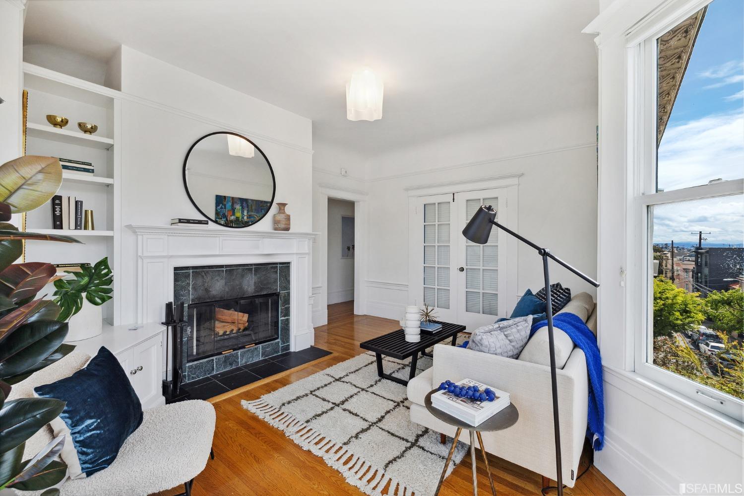 394 Elizabeth Street San Francisco, CA 94114 - Photo 28 of 33 a living room with furniture a rug and a fireplace