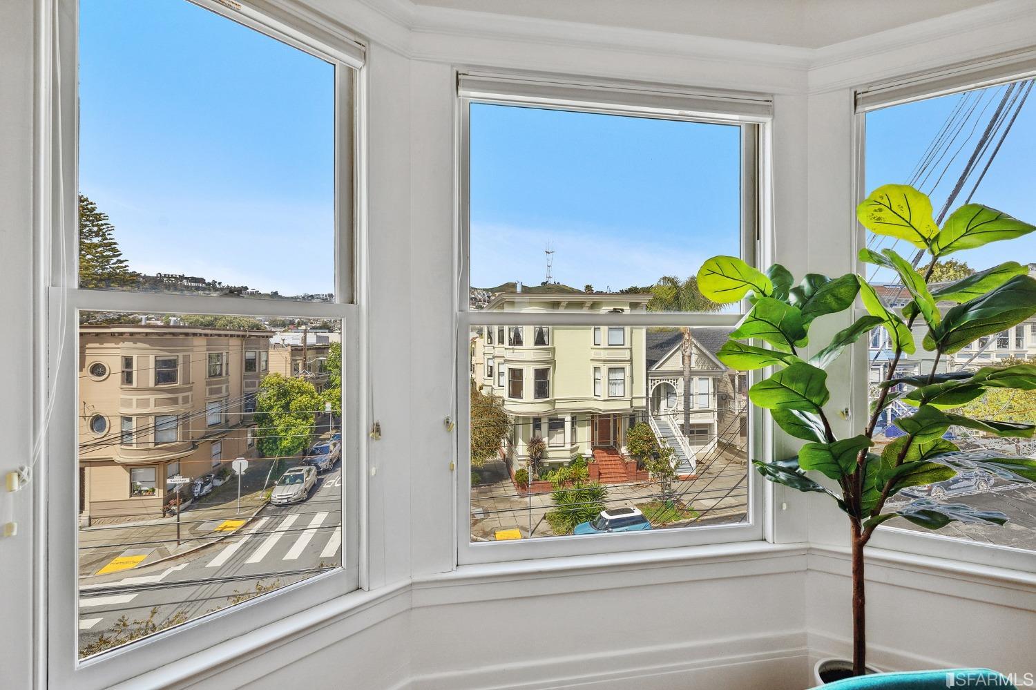 394 Elizabeth Street San Francisco, CA 94114 - Photo 29 of 33 a vase of flowers sitting on a window sill