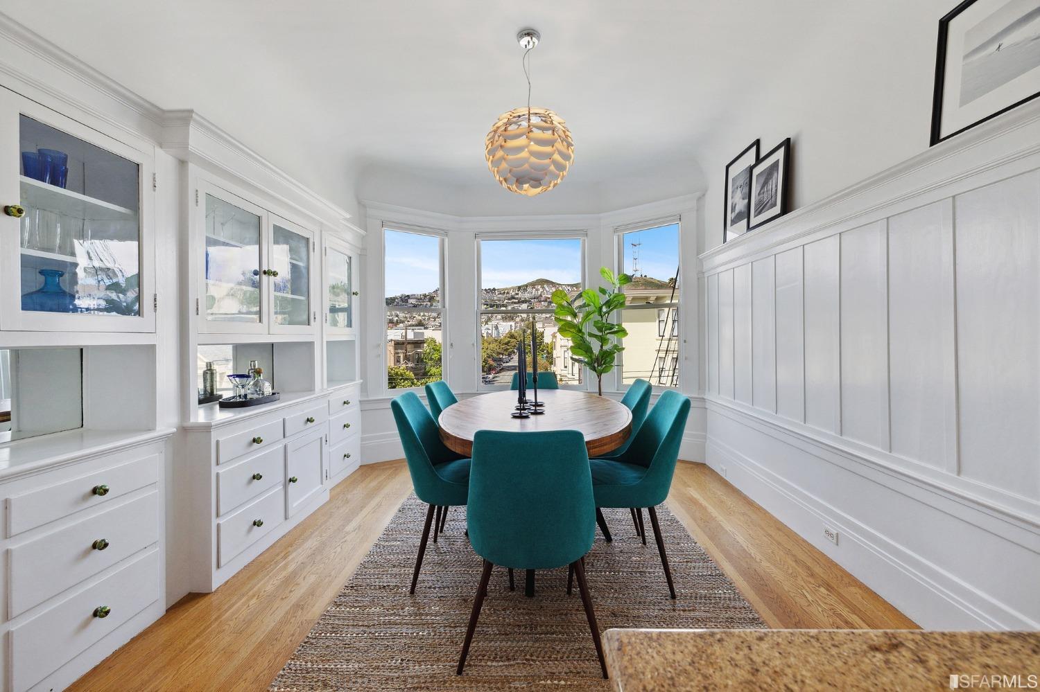 394 Elizabeth Street San Francisco, CA 94114 - Photo 9 of 33 a view of a dining room with furniture window and wooden floor