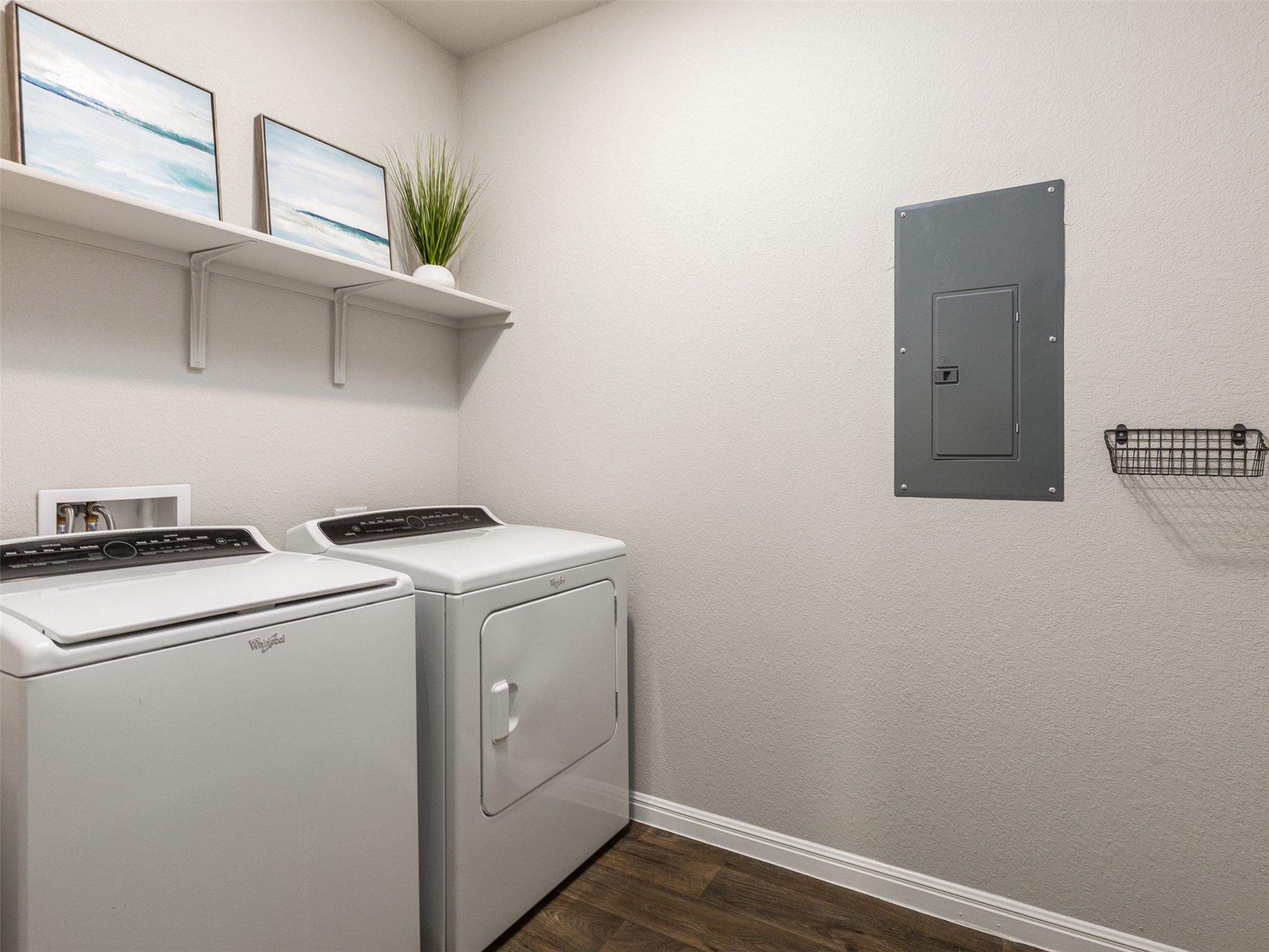 439 Hunter Loop Bertram, TX 78605 - Photo 21 of 23 Functional laundry space featuring a practical shelf for organization.