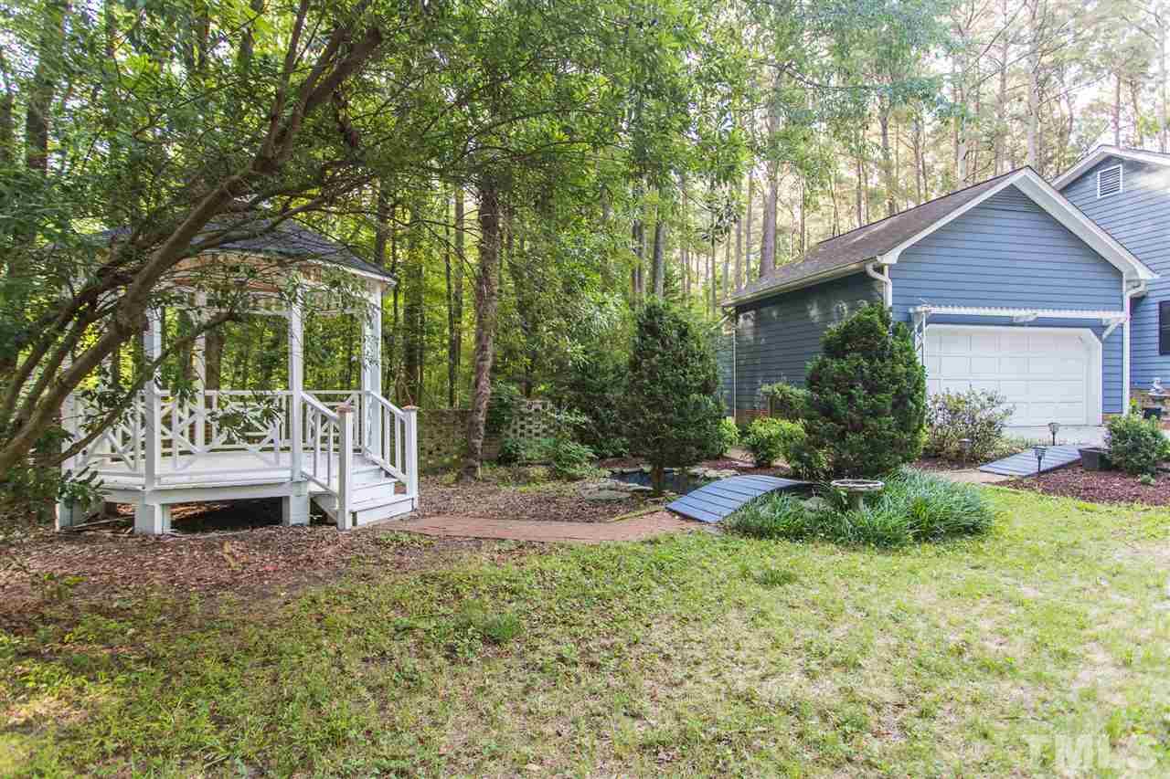 10008 Sycamore Road Raleigh, NC 27613 - Photo 23 of 26 Lovely gardens, brick walkway and fish pond