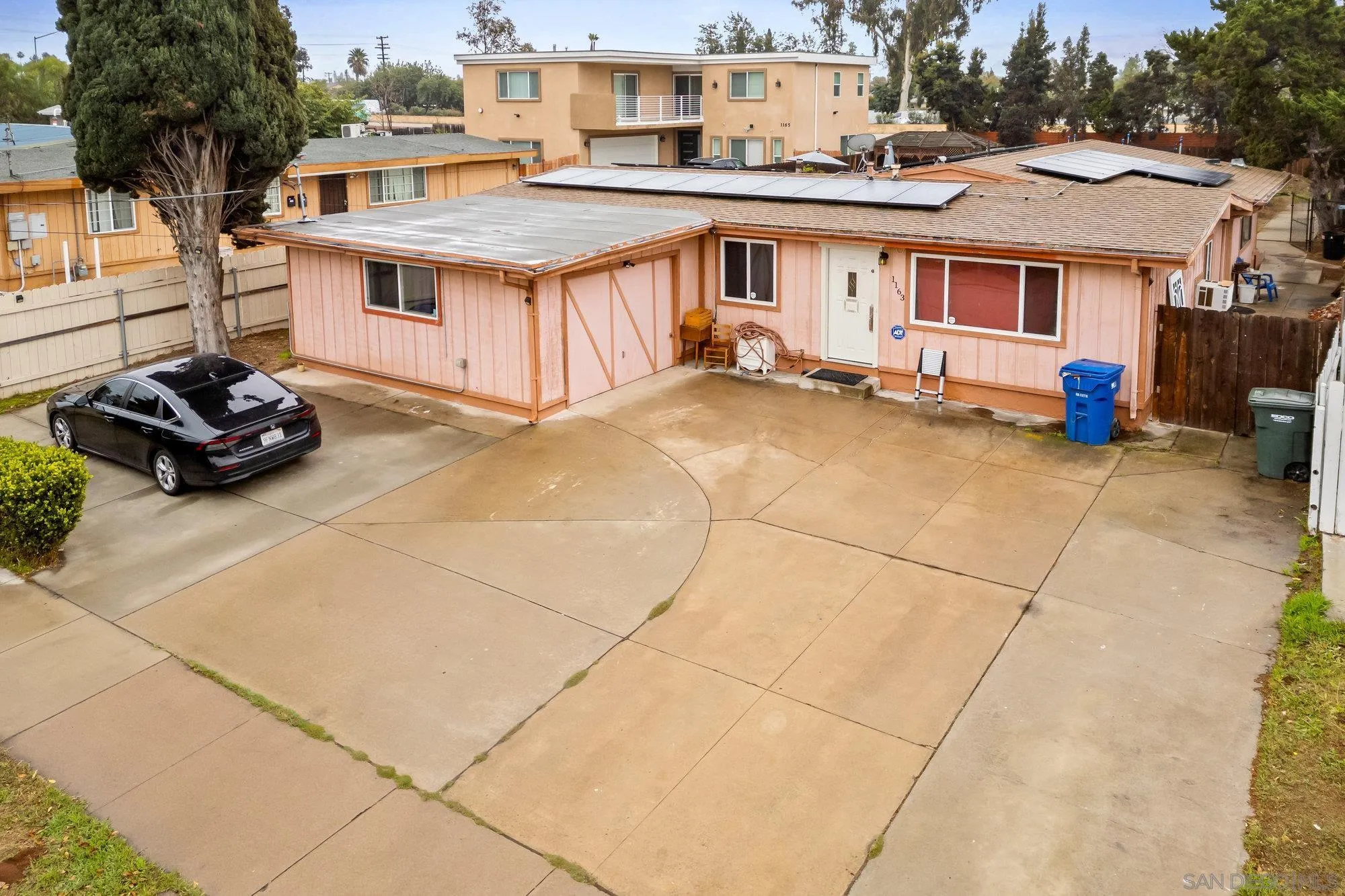 1163 Naranca Avenue El Cajon, CA 92021 - Photo 15 of 15 a view of a white house with a sink and a stove