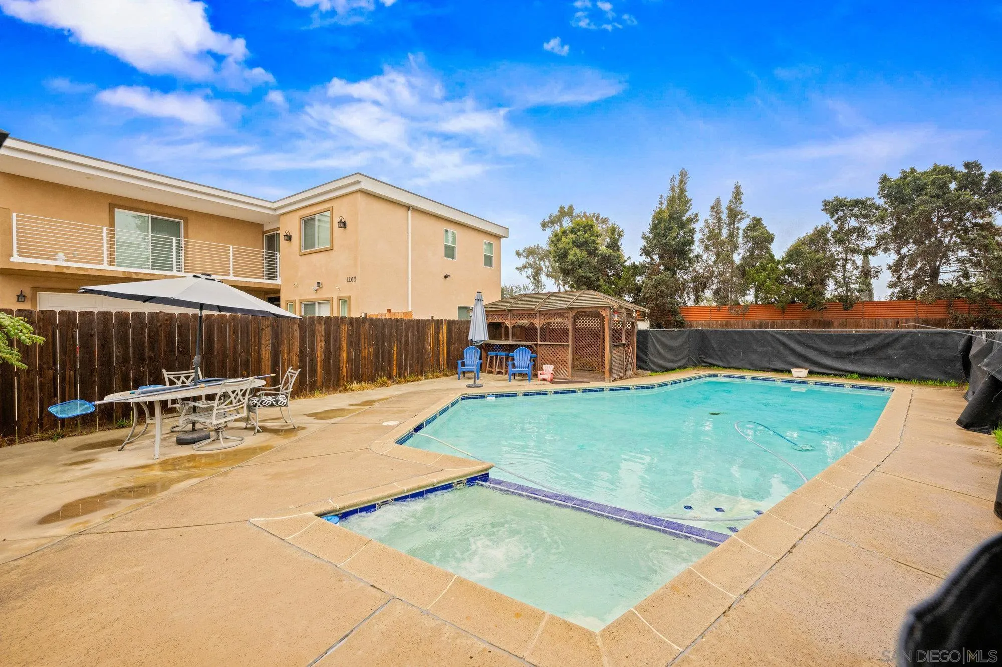 1163 Naranca Avenue El Cajon, CA 92021 - Photo 7 of 15 a backyard with a table and chairs