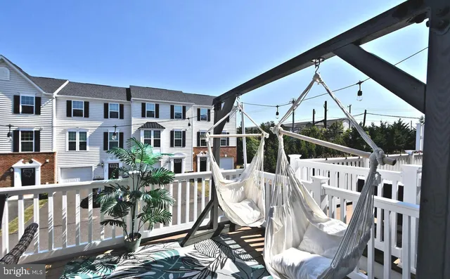 a view of a house with backyard porch and sitting area
