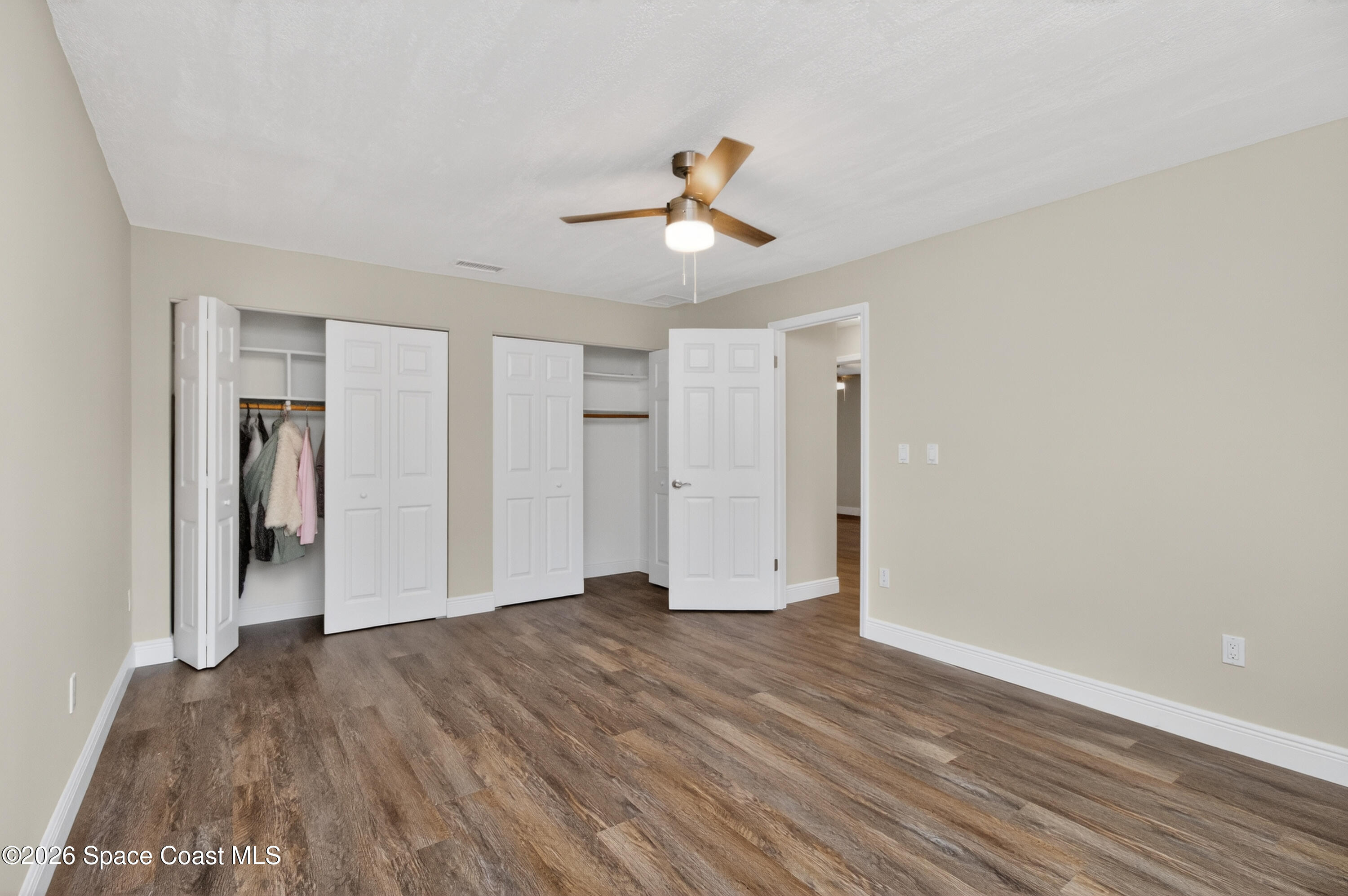 270 Mockingbird Lane Merritt Island, FL 32953 - Photo 27 of 41 a view of empty room with wooden floor
