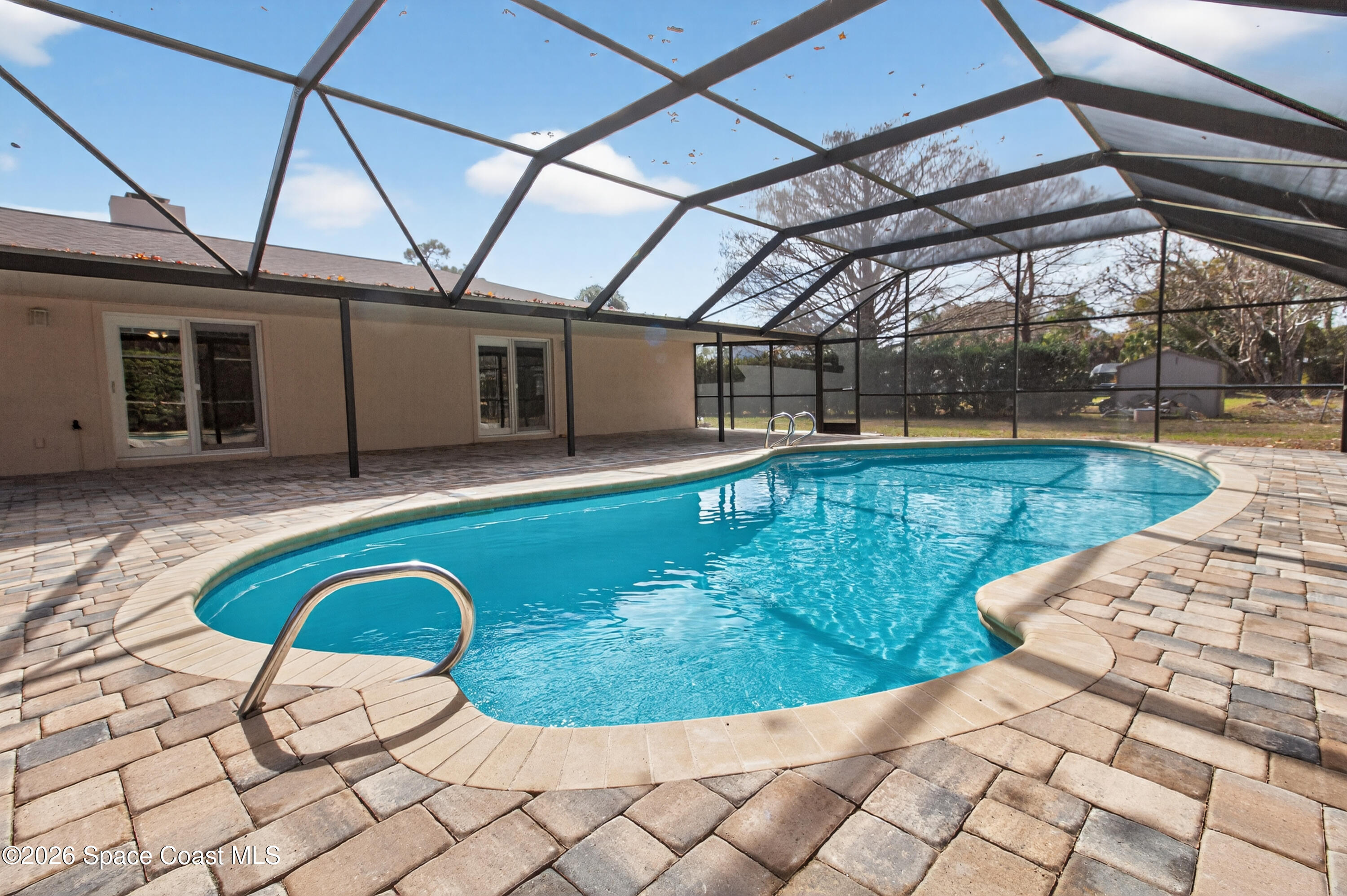 270 Mockingbird Lane Merritt Island, FL 32953 - Photo 3 of 41 a view of a swimming pool with a patio
