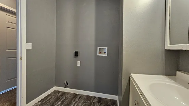 a bathroom with a sink and vanity