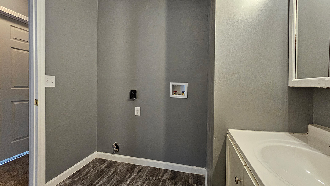 1702 West 9th Street Dixon, IL 61021 - Photo 7 of 9 a bathroom with a sink and vanity