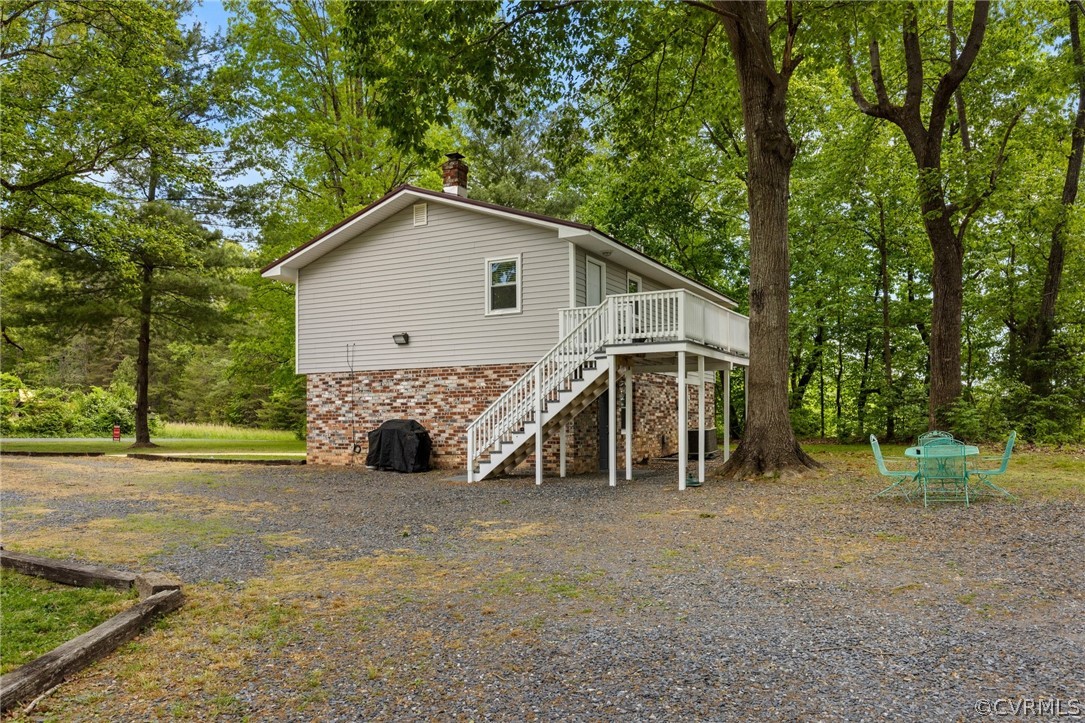 775 Belle Road Dillwyn, VA 23936 - Photo 25 of 29 a view of a house with a yard and large trees