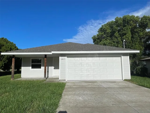 a front view of a house with a garage