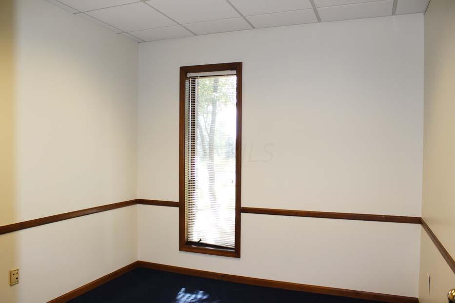 1900 Bethel Road Columbus, OH 43235 - Photo 21 of 24 New blue carpet ~02. Ivory painted walls. Suspended ceiling. Fluorescent lighting. Chair railing.
