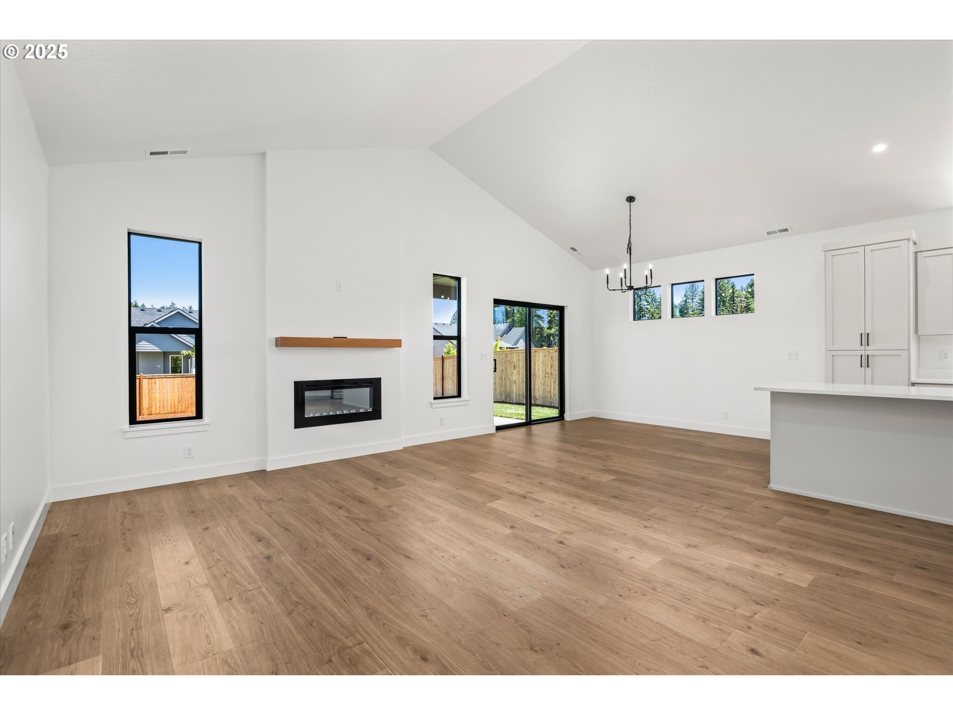 88139 Jameson Way Veneta, OR 97487 - Photo 17 of 26 a view of an empty room with a window and fireplace