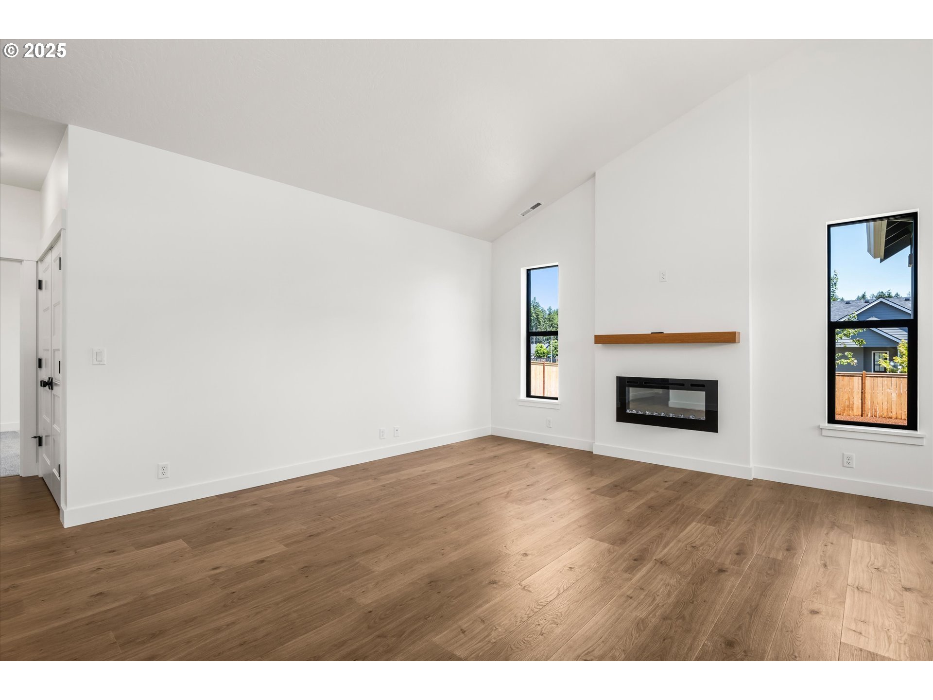 88139 Jameson Way Veneta, OR 97487 - Photo 20 of 26 a view of an empty room with window and fire place
