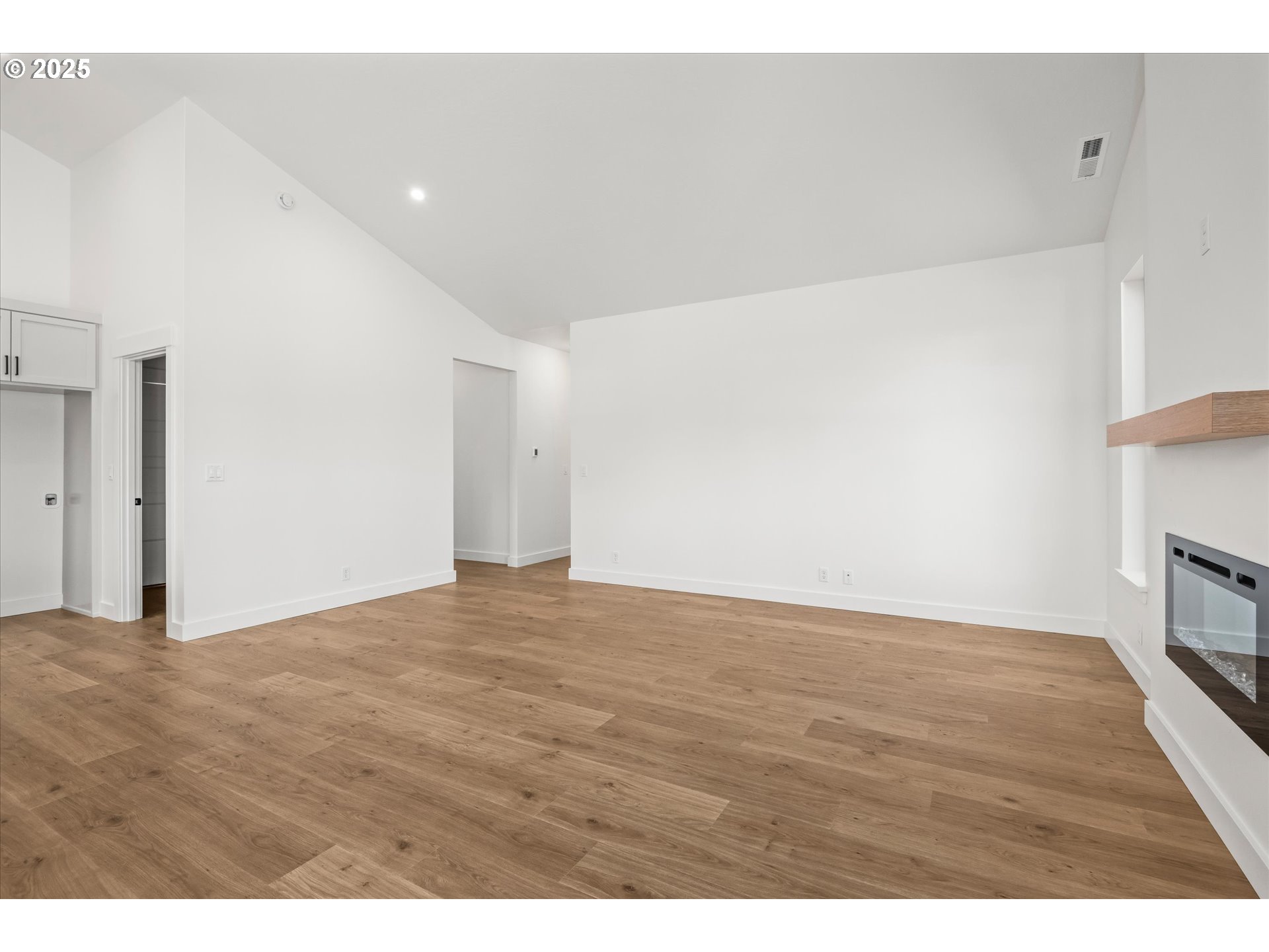 88139 Jameson Way Veneta, OR 97487 - Photo 21 of 26 a view of an empty room with wooden floor