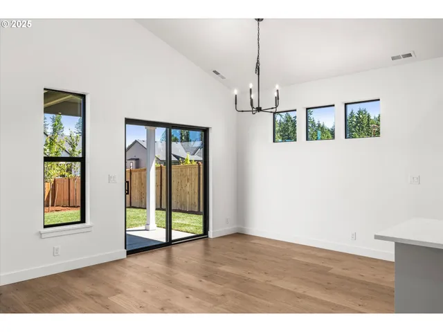 a view of an empty room with glass door