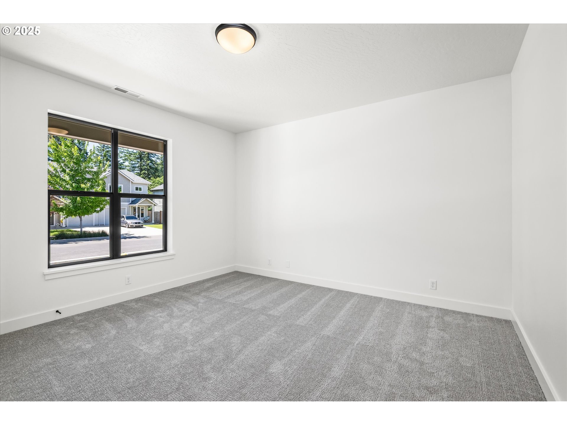 88139 Jameson Way Veneta, OR 97487 - Photo 5 of 26 a view of an empty room with a window