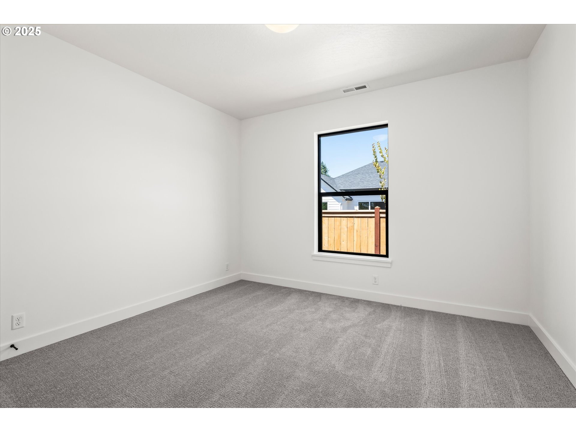 88139 Jameson Way Veneta, OR 97487 - Photo 7 of 26 a view of an empty room and window