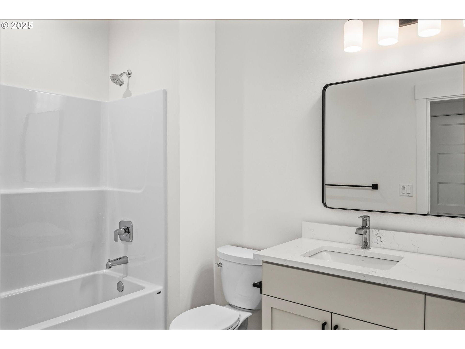 88139 Jameson Way Veneta, OR 97487 - Photo 9 of 26 a bathroom with a granite countertop sink mirror and a bathtub