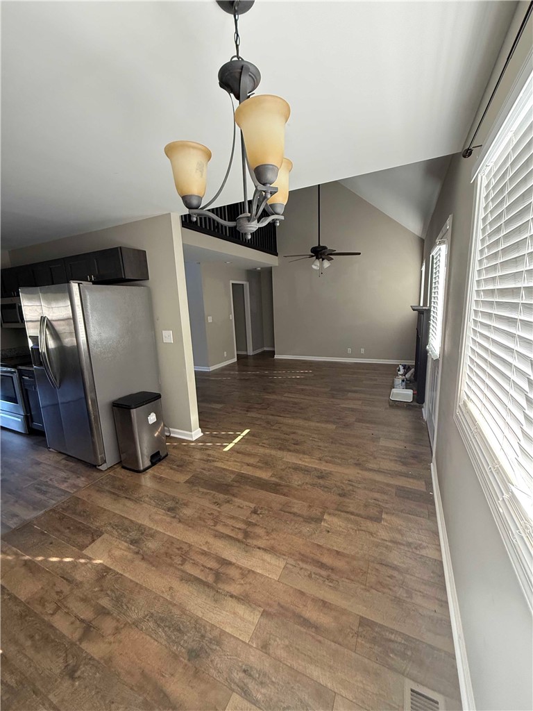 116 Kelly Lane Easley, SC 29642 - Photo 13 of 39 Rich wood-inspired floors flow seamlessly into a vaulted living space filled with natural light.