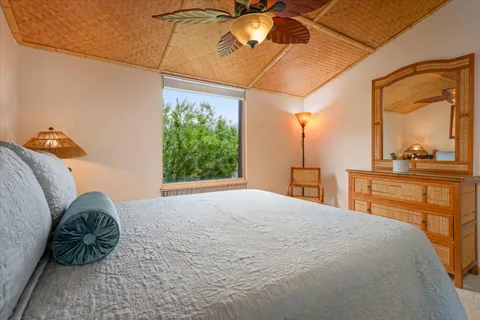 a bedroom with a bed and a dresser