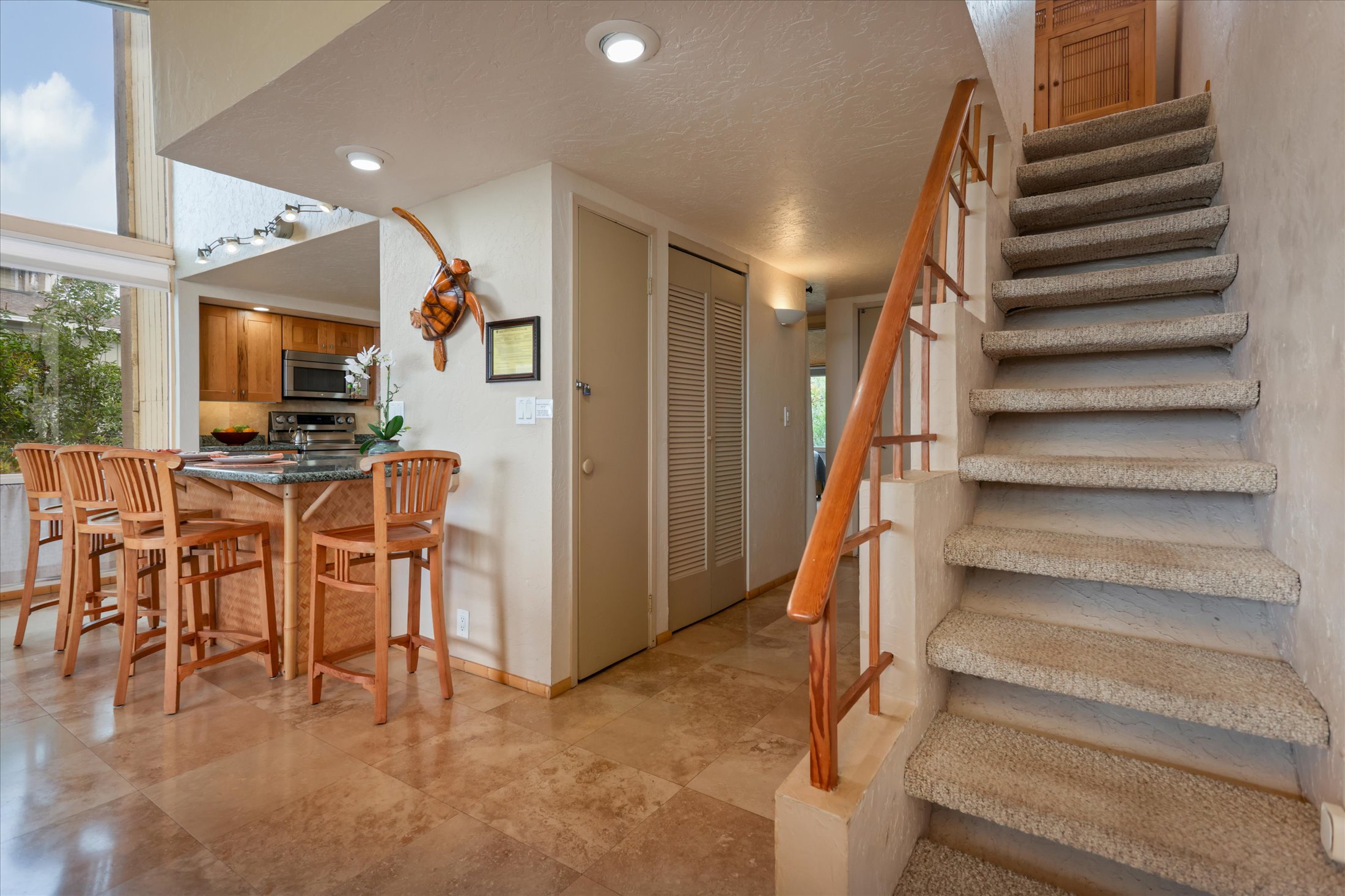 68-1771 Melia Street, Unit G214 Waikoloa, HI 96738 - Photo 20 of 29 a view of a livingroom with furniture and staircase