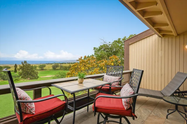 a view of a chairs and table in patio