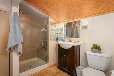 a bathroom with a sink toilet and shower