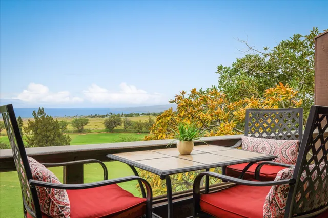 a view of a balcony with chairs