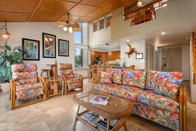 a living room with lots of furniture and a flat screen tv