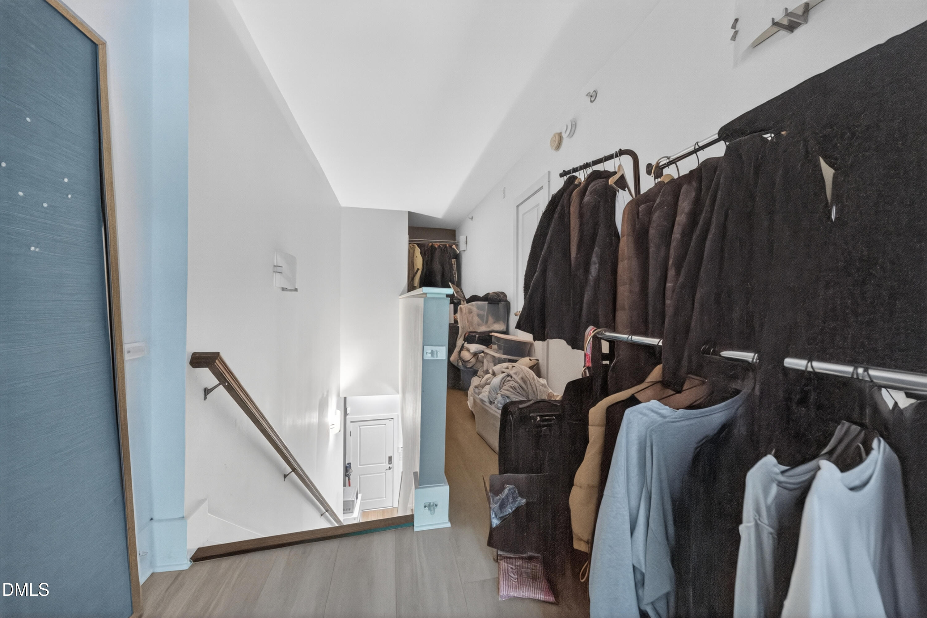 444 South Blount Street, Unit 111 Raleigh, NC 27601 - Photo 31 of 40 a view of walk in closet with clothes and shoes