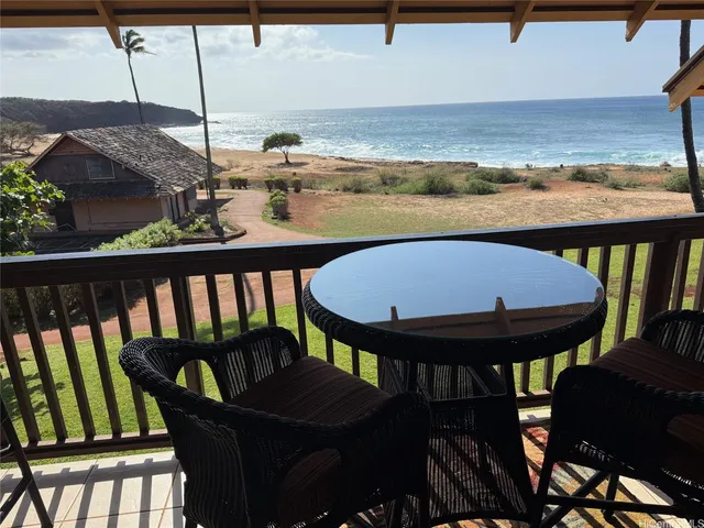 a view of balcony with wooden floor