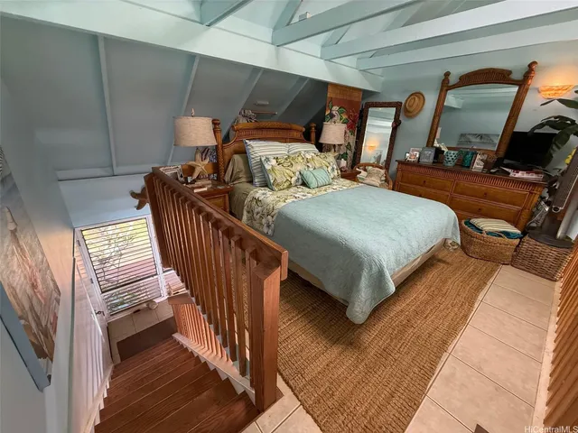 a bed room with furniture and a large window