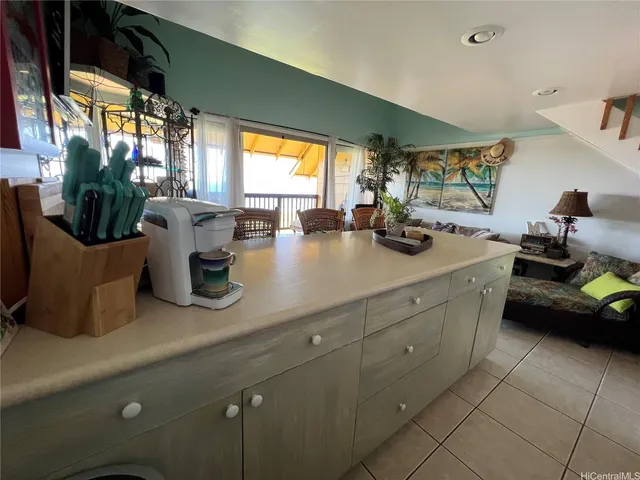a bedroom with a bed and a flat tv screen on dresser