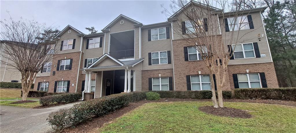 a front view of a house with yard