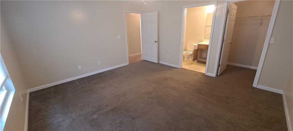 8304 Fairington Ridge Circle Lithonia, GA 30038 - Photo 11 of 14 an empty room with windows