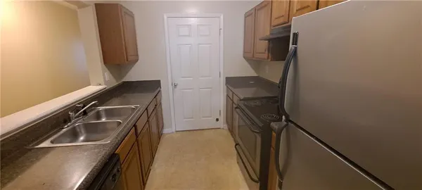 a bathroom with a sink a toilet and a shower