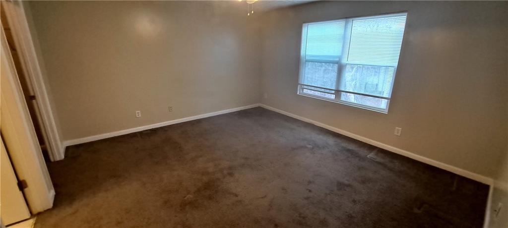 8304 Fairington Ridge Circle Lithonia, GA 30038 - Photo 10 of 14 an empty room with windows