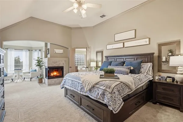 a bedroom with bed and a fireplace