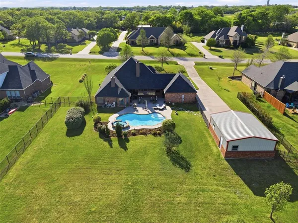 a view of a swimming pool with a patio