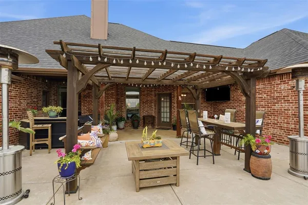 a view of a chairs and table in the patio