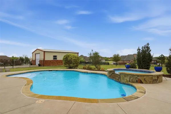 a view of a swimming pool with lounge chair
