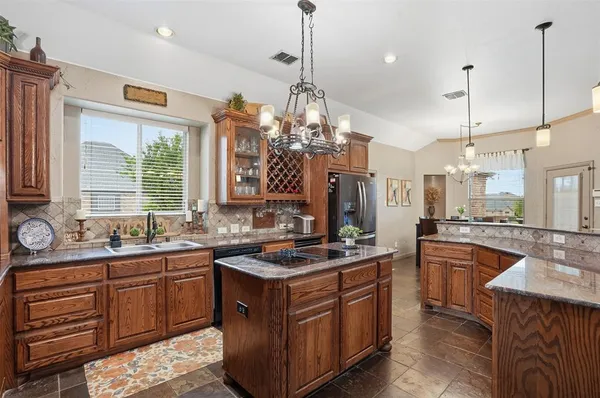 a kitchen with a sink stove and window