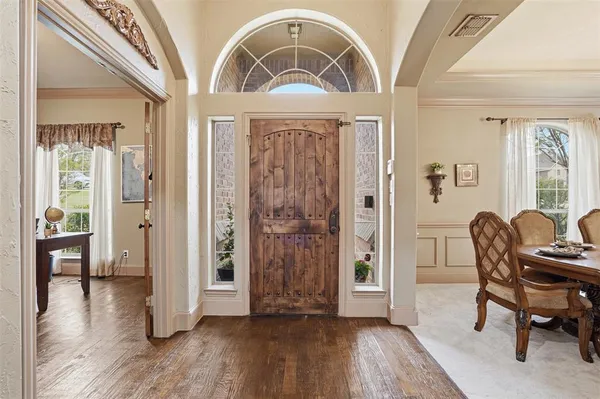 a view of a livingroom with furniture and hardwood floor